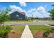 Exterior view of the neighborhood with well-maintained lawns, sidewalks, and inviting curb appeal at 939 Cobbled Way, Fort Mill, SC 29715