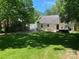 Large backyard with patio, string lights, and grassy area at 1422 Morningside Dr, Charlotte, NC 28205