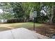 Backyard with basketball court and large grassy area at 1422 Morningside Dr, Charlotte, NC 28205
