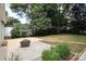 Large backyard with patio, fire pit and string lights at 1422 Morningside Dr, Charlotte, NC 28205