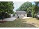 Large backyard with patio, firepit, and string lights at 1422 Morningside Dr, Charlotte, NC 28205