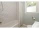 Clean bathroom with white subway tile shower and patterned shower curtain at 1422 Morningside Dr, Charlotte, NC 28205