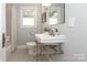 Charming bathroom with pedestal sink, subway tile, and updated fixtures at 1422 Morningside Dr, Charlotte, NC 28205