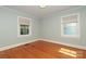Well-lit bedroom with hardwood floors and neutral walls at 1422 Morningside Dr, Charlotte, NC 28205