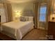Cozy bedroom with a full-size bed and plenty of natural light at 1422 Morningside Dr, Charlotte, NC 28205