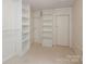 Spacious closet with built-in shelves and hanging rod at 1422 Morningside Dr, Charlotte, NC 28205