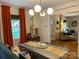 Bright dining room with a large table, and view into living room at 1422 Morningside Dr, Charlotte, NC 28205