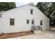 White brick home with a side entrance and landscaping at 1422 Morningside Dr, Charlotte, NC 28205