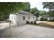 White brick home with a large backyard and chain link fence at 1422 Morningside Dr, Charlotte, NC 28205