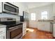 Modern kitchen with stainless steel appliances and white cabinets at 1422 Morningside Dr, Charlotte, NC 28205