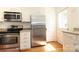 Modern kitchen with stainless steel appliances and white cabinets at 1422 Morningside Dr, Charlotte, NC 28205