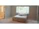 Main bedroom with a large bed and access to bathroom at 181 Dairy Farm Rd, Mooresville, NC 28115