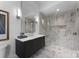 Elegant bathroom featuring marble accents, a modern glass shower, and sleek dark wood vanity at 2116 Woodhaven Rd, Charlotte, NC 28211