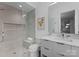 Modern bathroom with glass shower, neutral color palette, and sleek vanity with ample counter space at 2116 Woodhaven Rd, Charlotte, NC 28211