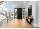 Bright and inviting foyer featuring hardwood floors, a modern staircase, and ample natural light at 2116 Woodhaven Rd, Charlotte, NC 28211