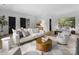 Living area showcasing modern furniture and decor, open to the bedroom, with plenty of natural light at 2116 Woodhaven Rd, Charlotte, NC 28211