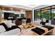 Inviting living room featuring stylish furniture, hardwood floors, and views to the kitchen at 2116 Woodhaven Rd, Charlotte, NC 28211
