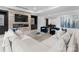 Modern living room with a sleek fireplace, built-in shelving, and comfortable seating with luxury finishes at 2116 Woodhaven Rd, Charlotte, NC 28211