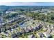 A neighborhood aerial view exhibits similar rooflines, landscaping, and a community pool in the distance at 4023 Home Grown Way, Lake Wylie, SC 29710