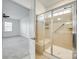 Updated bathroom with glass enclosed shower with handrail and neutral tile at 4023 Home Grown Way, Lake Wylie, SC 29710