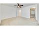 Bedroom with neutral carpeting, lighted ceiling fan, an adjacent walk-in closet at 4023 Home Grown Way, Lake Wylie, SC 29710