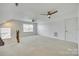 Large bonus room with neutral carpet, windows, and ceiling fans at 4023 Home Grown Way, Lake Wylie, SC 29710