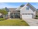 Charming single-Gathering home with a well-manicured lawn and two-car garage at 4023 Home Grown Way, Lake Wylie, SC 29710