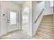 Bright foyer with hardwood floors and staircase leading to upper level at 4023 Home Grown Way, Lake Wylie, SC 29710