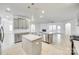 Spacious kitchen with an island, stainless steel appliances, and open access to the living room area at 4023 Home Grown Way, Lake Wylie, SC 29710