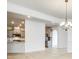 Bright living room featuring hardwood floors, a chandelier, and seamless access to the kitchen area at 4023 Home Grown Way, Lake Wylie, SC 29710