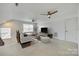 Upstairs living room with plush carpeting, contemporary furnishings, and natural light at 4023 Home Grown Way, Lake Wylie, SC 29710