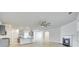 Open-concept living room showcasing hardwood floors, abundant natural light, and seamless flow to kitchen at 4023 Home Grown Way, Lake Wylie, SC 29710