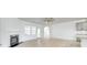 Bright living room with a modern fireplace, large windows, and direct access to the kitchen area at 4023 Home Grown Way, Lake Wylie, SC 29710