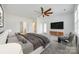 Bright main bedroom with ensuite bathroom, ceiling fan, and exterior door at 4023 Home Grown Way, Lake Wylie, SC 29710