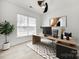 Modern office with contemporary ceiling fan, geometric rug, and bright window view at 4023 Home Grown Way, Lake Wylie, SC 29710