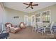 Screened in porch with ceiling fan, seating, and a dining table at 4023 Home Grown Way, Lake Wylie, SC 29710