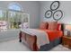 Bright bedroom with wooden sleigh bed and orange bedding at 7812 Burning Ridge Dr, Stanley, NC 28164