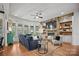 Open living room with stone fireplace and built-in shelving at 7812 Burning Ridge Dr, Stanley, NC 28164