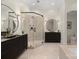 Elegant bathroom with a large walk-in shower and double vanity at 127 Tryon N St # 503, Charlotte, NC 28202