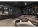 Sophisticated home theater with built-in bar and ample seating at 127 Tryon N St # 503, Charlotte, NC 28202