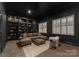 Sophisticated media room featuring built-in shelving and comfortable seating at 127 Tryon N St # 503, Charlotte, NC 28202