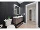 Modern powder room with dark patterned wallpaper and updated vanity at 127 Tryon N St # 503, Charlotte, NC 28202