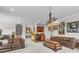 Basement entertainment area features a wet bar, two sofas, and recessed lighting at 130 Stonewall Beach Ln, Mooresville, NC 28117