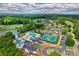 Aerial view of community amenities, including swimming pools, tennis courts, and a golf course, perfect for recreation at 130 Stonewall Beach Ln, Mooresville, NC 28117