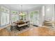 Bright dining area with large windows, a chandelier, and a dining table with seating for six at 130 Stonewall Beach Ln, Mooresville, NC 28117