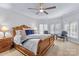 Serene bedroom showcases a wood-framed bed, and two bedside lamps, creating a relaxing retreat at 130 Stonewall Beach Ln, Mooresville, NC 28117