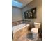 Relaxing bathroom with soaking tub and updated fixtures at 1409 Trinity Church Rd, Monroe, NC 28112