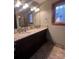 Double vanity bathroom with granite countertops at 1409 Trinity Church Rd, Monroe, NC 28112