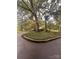 Landscaped circular driveway and mature trees at 1409 Trinity Church Rd, Monroe, NC 28112