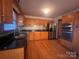 Kitchen with wood cabinets, granite counters, and stainless steel appliances at 1409 Trinity Church Rd, Monroe, NC 28112